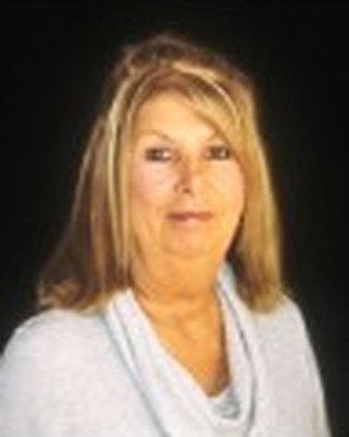 Memorial portrait of Sandy Arthur, cropped from the public obituary photo